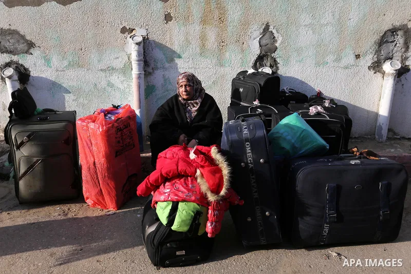 Palestinians wait for travel permits to cross into Egypt through the Rafah border crossing after it was opened by Egyptian authorities for humanitarian cases, in Rafah in the southern Gaza Strip on February 11, 2017. Pho...