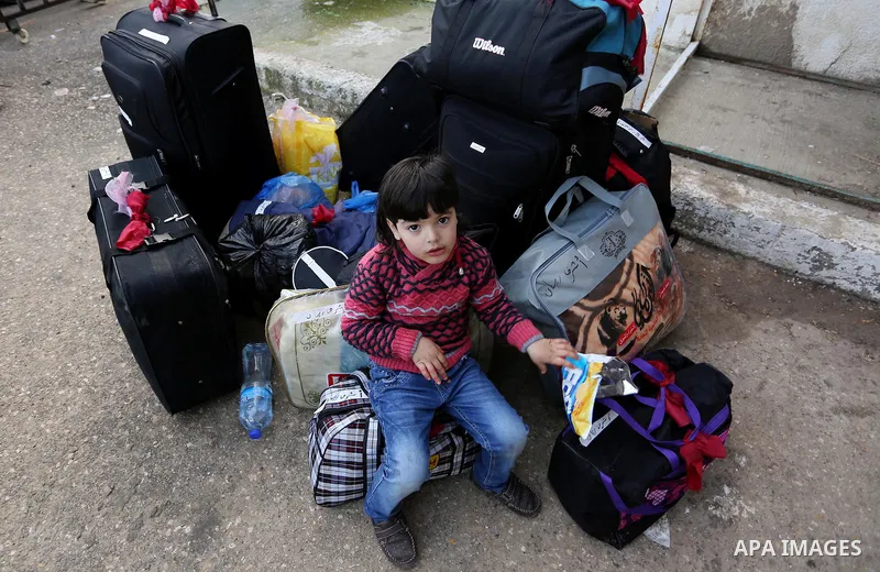 Palestinians wait for travel permits to cross into Egypt through the Rafah border crossing after it was opened by Egyptian authorities for humanitarian cases, in Rafah in the southern Gaza Strip on February 11, 2017. Pho...