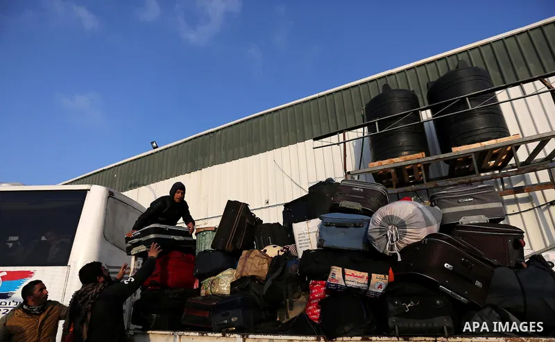 Palestinians wait for travel permits to cross into Egypt through the Rafah border crossing after it was opened by Egyptian authorities for humanitarian cases, in Rafah in the southern Gaza Strip on February 11, 2017. Pho...