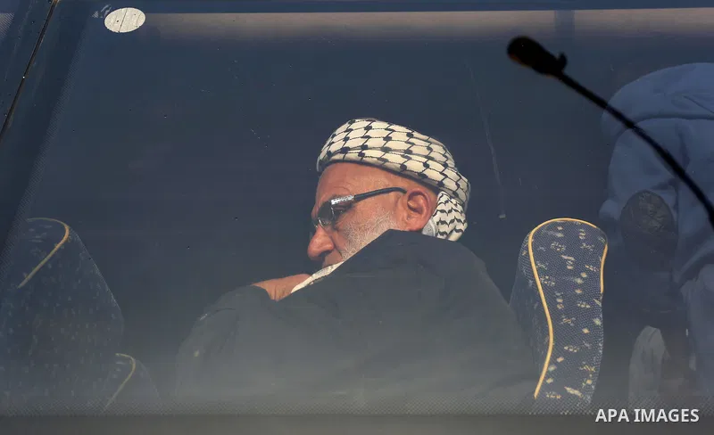 Palestinians sits in a bus as they wait for travel permits to cross into Egypt through the Rafah border crossing after it was opened by Egyptian authorities for humanitarian cases, in Rafah in the southern Gaza Strip on...
