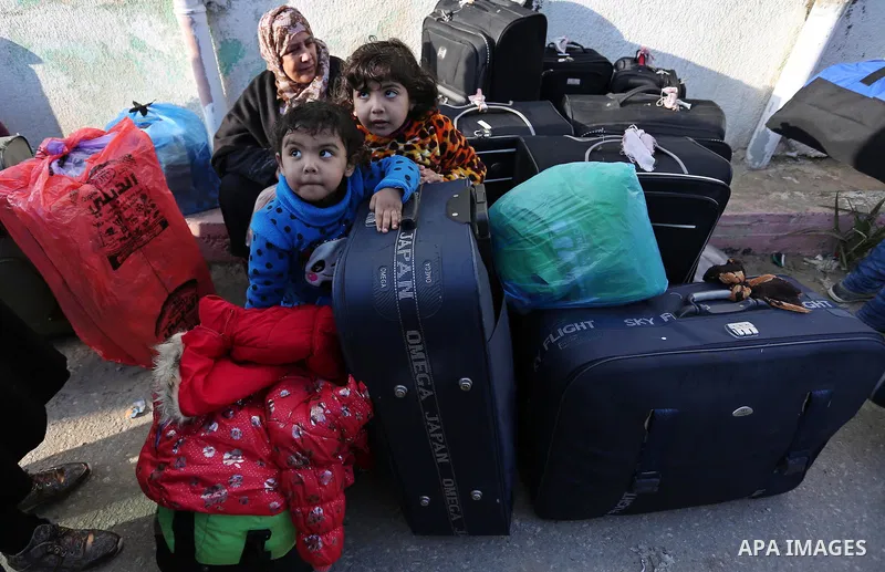 Palestinians wait for travel permits to cross into Egypt through the Rafah border crossing after it was opened by Egyptian authorities for humanitarian cases, in Rafah in the southern Gaza Strip on February 11, 2017. Pho...