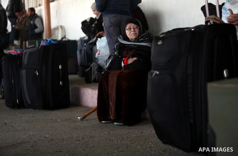 Palestinians wait for travel permits to cross into Egypt through the Rafah border crossing after it was opened by Egyptian authorities for humanitarian cases, in Rafah in the southern Gaza Strip on February 11, 2017. Pho...