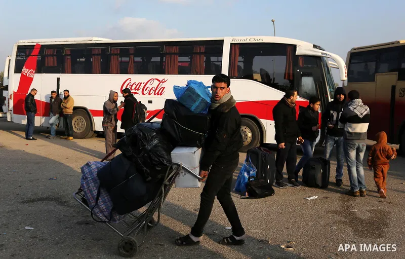 Palestinians wait for travel permits to cross into Egypt through the Rafah border crossing after it was opened by Egyptian authorities for humanitarian cases, in Rafah in the southern Gaza Strip on February 11, 2017. Pho...