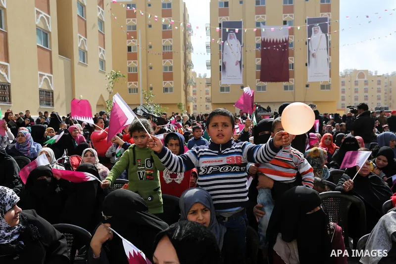 Palestinians attend the ceremony of the second phase of the Sheikh Hamad Town, in Khan Younis in the southern Gaza strip, on February 11, 2017. Photo by Ashraf Amra