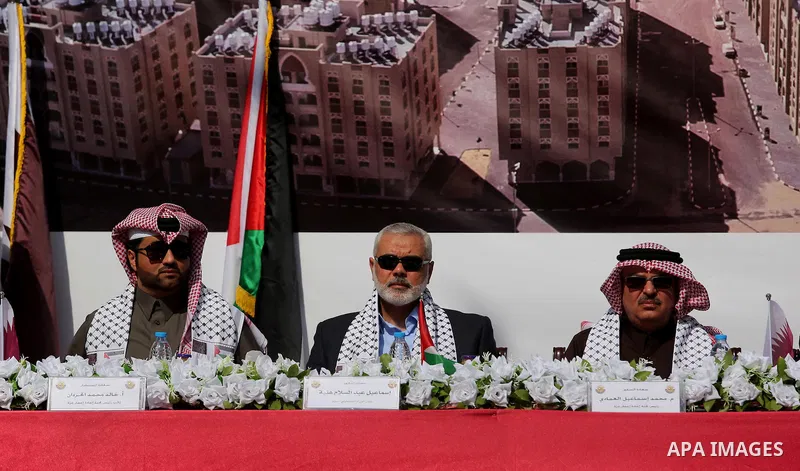 Hamas leader Ismail Haniyeh and Qatar's Ambassador to the Palestinian Authority, Mohammed Al Emadi attend the ceremony of the second phase of the Sheikh Hamad Town, in Khan Younis in the southern Gaza strip, on February...