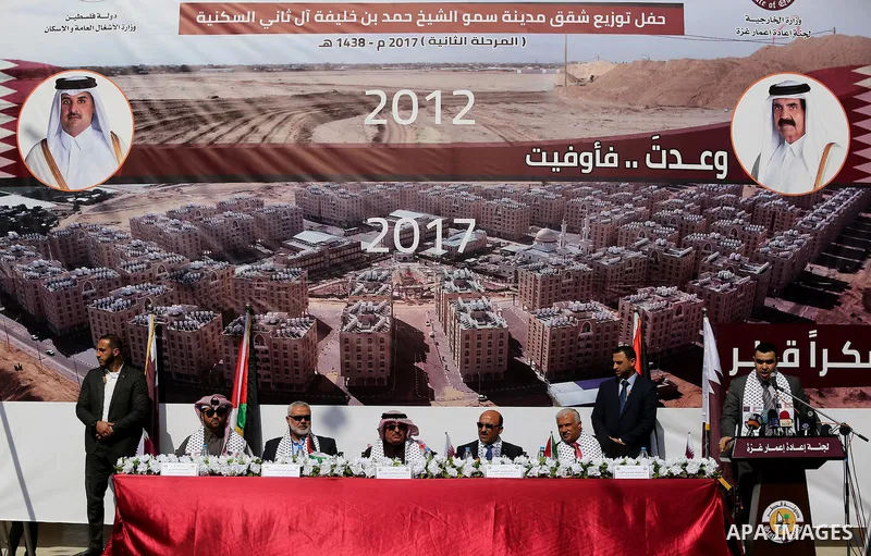 Hamas leader Ismail Haniyeh and Qatar's Ambassador to the Palestinian Authority, Mohammed Al Emadi attend the ceremony of the second phase of the Sheikh Hamad Town, in Khan Younis in the southern Gaza strip, on February...
