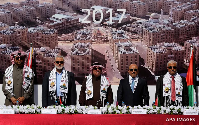 Hamas leader Ismail Haniyeh and Qatar's Ambassador to the Palestinian Authority, Mohammed Al Emadi attend the ceremony of the second phase of the Sheikh Hamad Town, in Khan Younis in the southern Gaza strip, on February...