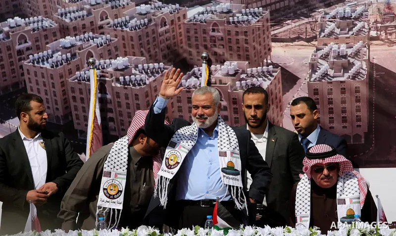 Hamas leader Ismail Haniyeh waves during the ceremony of the second phase of the Sheikh Hamad Town, in Khan Younis in the southern Gaza strip, on February 11, 2017. Photo by Ashraf Amra