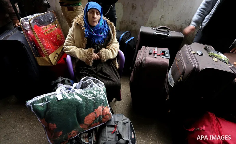 Palestinians wait for travel permits to cross into Egypt through the Rafah border crossing after it was opened by Egyptian authorities for humanitarian cases, in Rafah in the southern Gaza Strip on February 12, 2017. Pho...