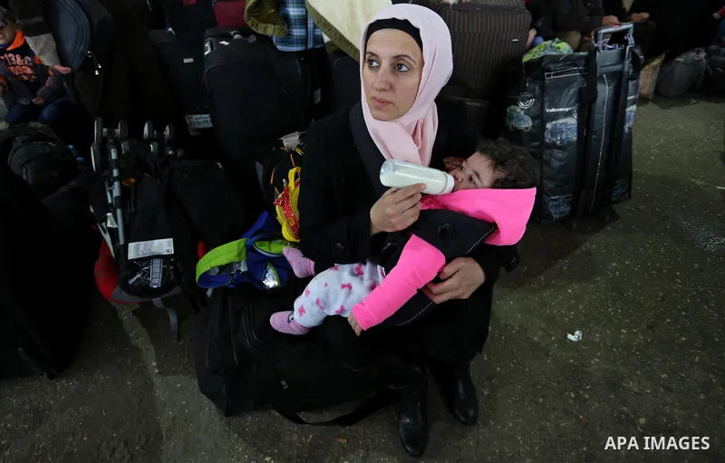 Palestinians wait for travel permits to cross into Egypt through the Rafah border crossing after it was opened by Egyptian authorities for humanitarian cases, in Rafah in the southern Gaza Strip on February 12, 2017. Pho...