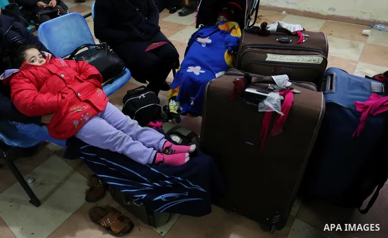 Palestinians wait for travel permits to cross into Egypt through the Rafah border crossing after it was opened by Egyptian authorities for humanitarian cases, in Rafah in the southern Gaza Strip on February 12, 2017. Pho...