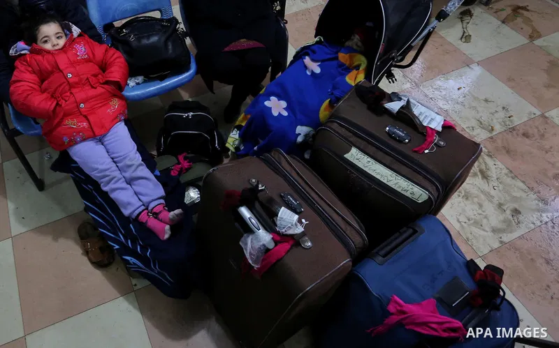 Palestinians wait for travel permits to cross into Egypt through the Rafah border crossing after it was opened by Egyptian authorities for humanitarian cases, in Rafah in the southern Gaza Strip on February 12, 2017. Pho...