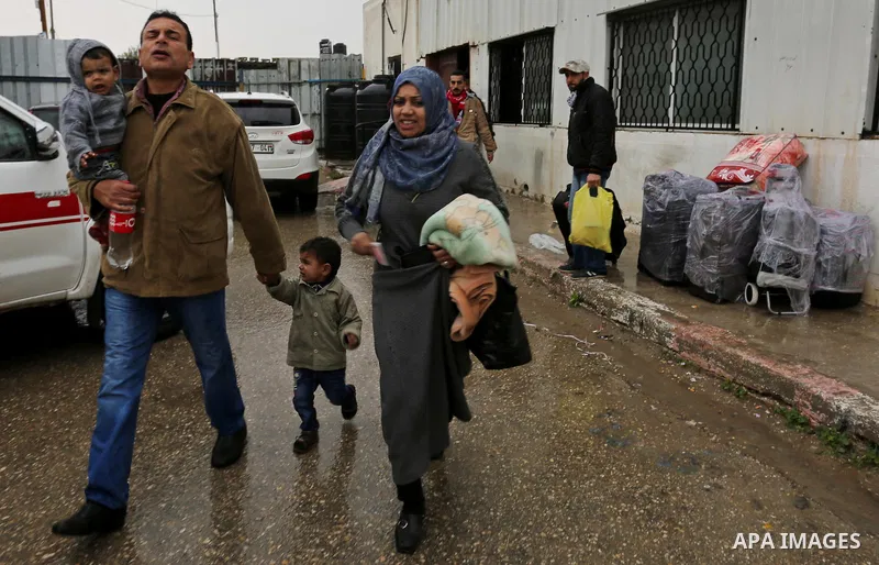 Palestinians wait for travel permits to cross into Egypt through the Rafah border crossing after it was opened by Egyptian authorities for humanitarian cases, in Rafah in the southern Gaza Strip on February 12, 2017. Pho...