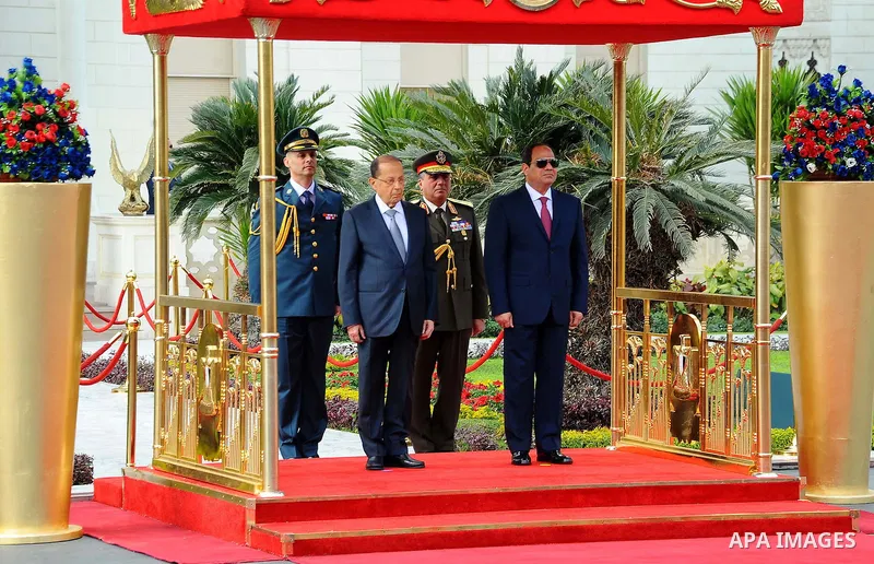 Egyptian President Abdel Fattah al-Sisi and Lebanese President Michel Aoun inspect the honor guards during the a welcome ceremony at the Presidential palace in Cairo on February 13, 2017. Aoun started his first visit to...