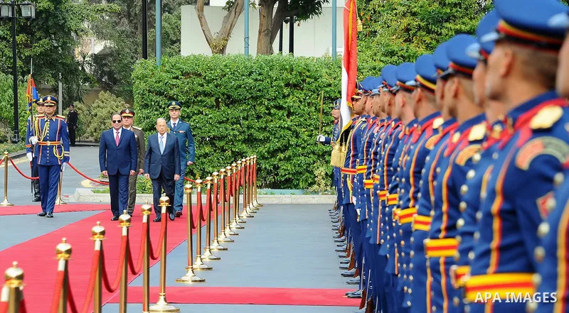 Egyptian President Abdel Fattah al-Sisi and Lebanese President Michel Aoun inspect the honor guards during the a welcome ceremony at the Presidential palace in Cairo on February 13, 2017. Aoun started his first visit to...