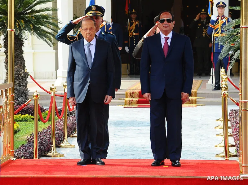 Egyptian President Abdel Fattah al-Sisi and Lebanese President Michel Aoun inspect the honor guards during the a welcome ceremony at the Presidential palace in Cairo on February 13, 2017. Aoun started his first visit to...