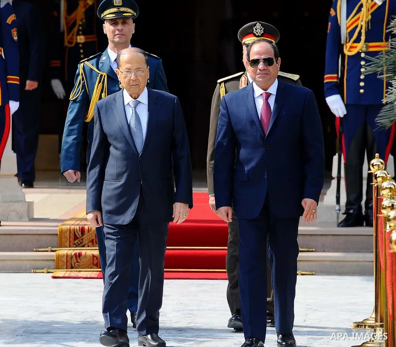 Egyptian President Abdel Fattah al-Sisi and Lebanese President Michel Aoun inspect the honor guards during the a welcome ceremony at the Presidential palace in Cairo on February 13, 2017. Aoun started his first visit to...