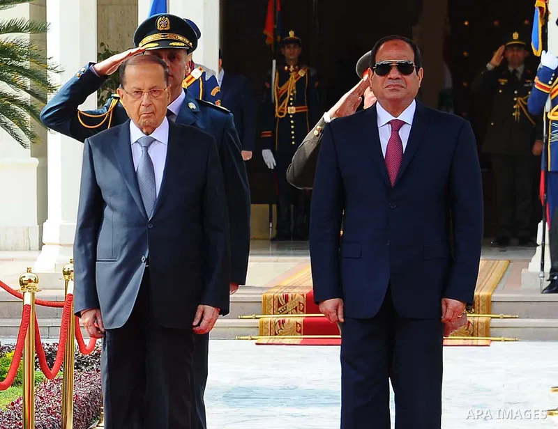 Egyptian President Abdel Fattah al-Sisi and Lebanese President Michel Aoun inspect the honor guards during the a welcome ceremony at the Presidential palace in Cairo on February 13, 2017. Aoun started his first visit to...