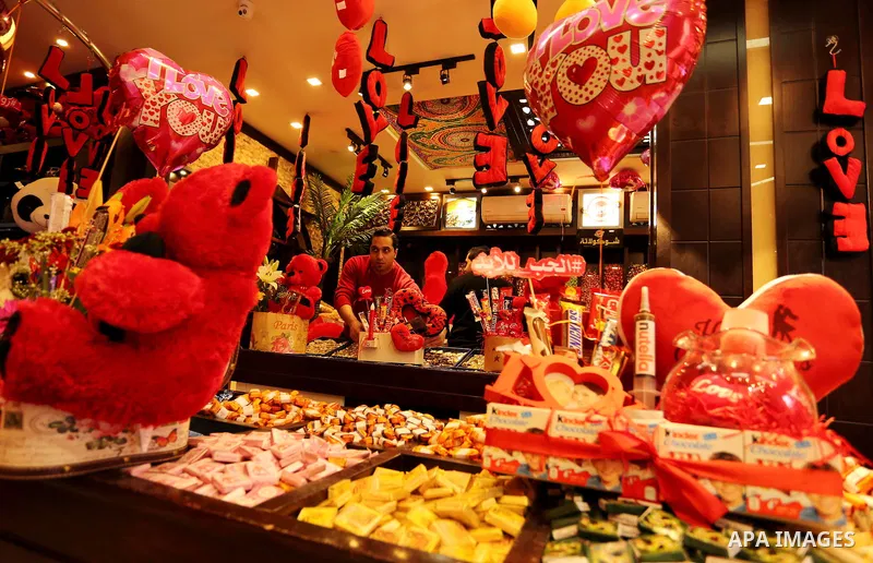 Palestinian vendors display flowers, red teddy bears, red ballons and pillows on Valentine's day in Gaza city on February 14, 2017. Valentine's Day is increasingly popular in the region as people have taken up the custom...