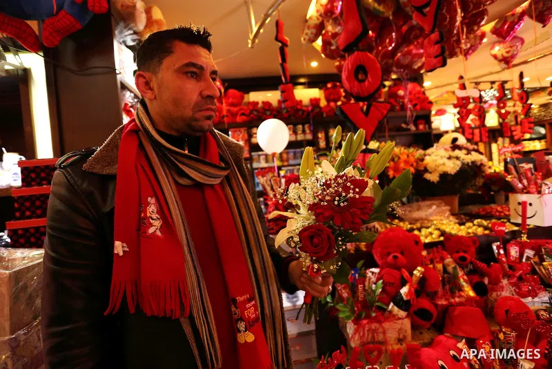 Palestinian vendors display flowers, red teddy bears, red ballons and pillows on Valentine's day in Gaza city on February 14, 2017. Valentine's Day is increasingly popular in the region as people have taken up the custom...