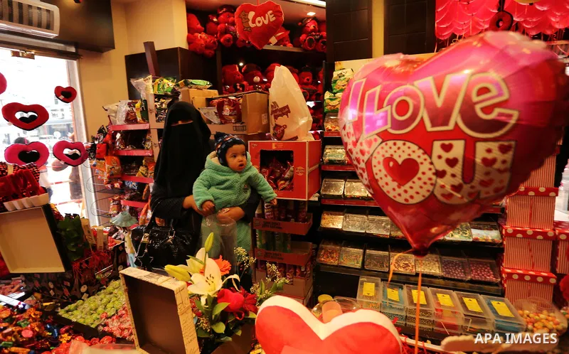 Palestinian vendors display flowers, red teddy bears, red ballons and pillows on Valentine's day in Gaza city on February 14, 2017. Valentine's Day is increasingly popular in the region as people have taken up the custom...