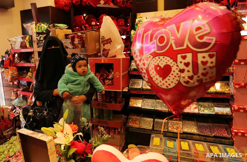 Palestinian vendors display flowers, red teddy bears, red ballons and pillows on Valentine's day in Gaza city on February 14, 2017. Valentine's Day is increasingly popular in the region as people have taken up the custom...