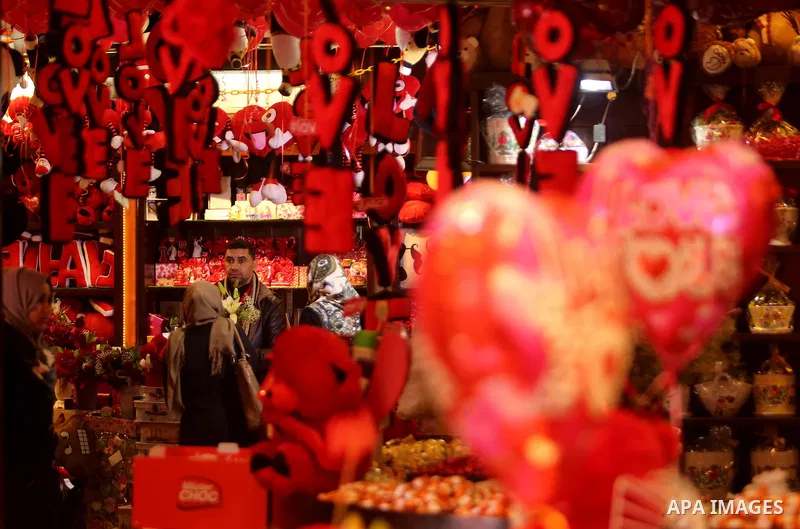 Palestinian vendors display flowers, red teddy bears, red ballons and pillows on Valentine's day in Gaza city on February 14, 2017. Valentine's Day is increasingly popular in the region as people have taken up the custom...