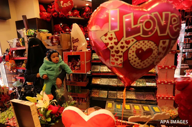 Palestinian vendors display flowers, red teddy bears, red ballons and pillows on Valentine's day in Gaza city on February 14, 2017. Valentine's Day is increasingly popular in the region as people have taken up the custom...