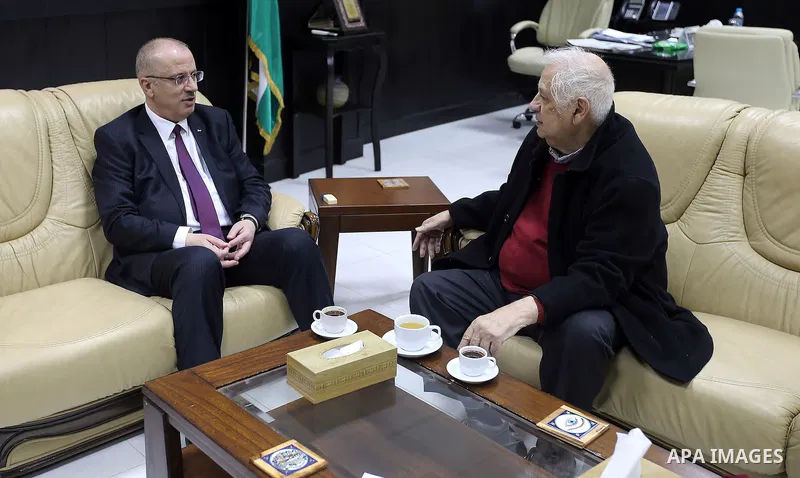 Palestinian Prime Minister, Rami Hamdallah, meets with the Palestinian chief of Election Commissioner, Hanna Nasser, in the West Bank city of Ramallah, on February 15, 2017. Photo by Prime Minister Office