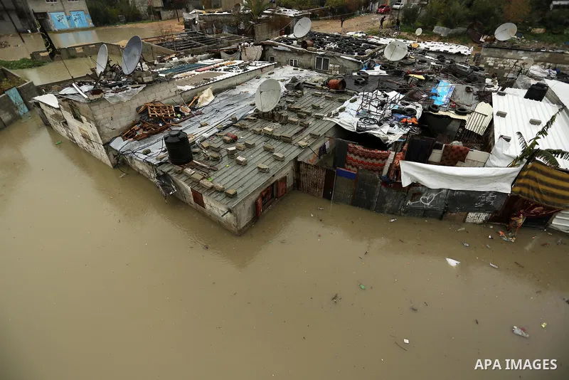 Flooded houses are seen following heavy rain in a neighbourhood in the northern Gaza Strip February 16, 2017. Photo by Ashraf Amra