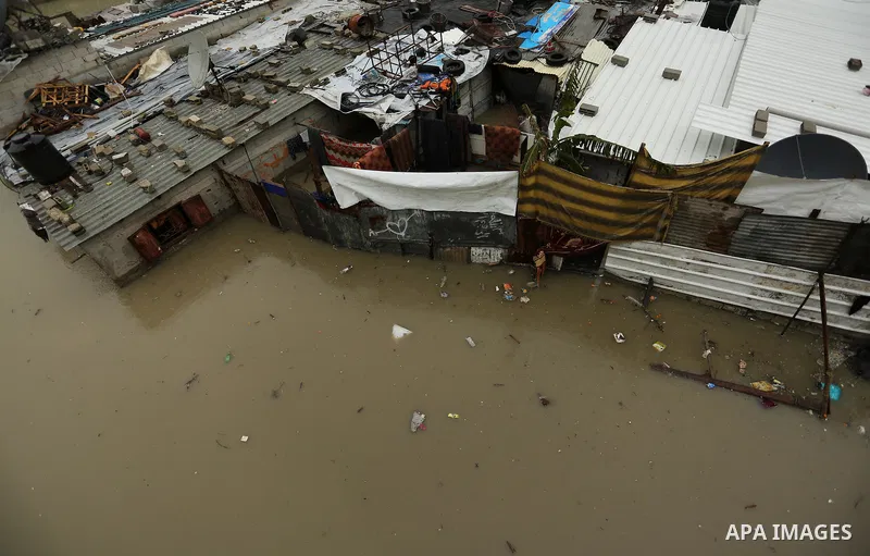 Flooded houses are seen following heavy rain in a neighbourhood in the northern Gaza Strip February 16, 2017. Photo by Ashraf Amra