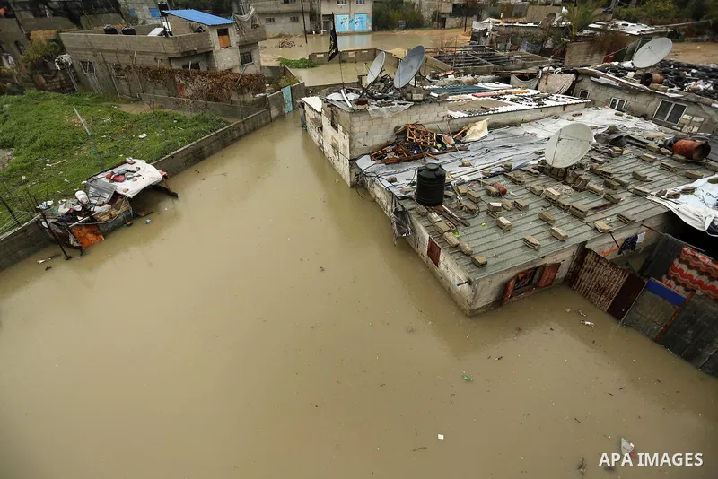 Flooded houses are seen following heavy rain in a neighbourhood in the northern Gaza Strip February 16, 2017. Photo by Ashraf Amra