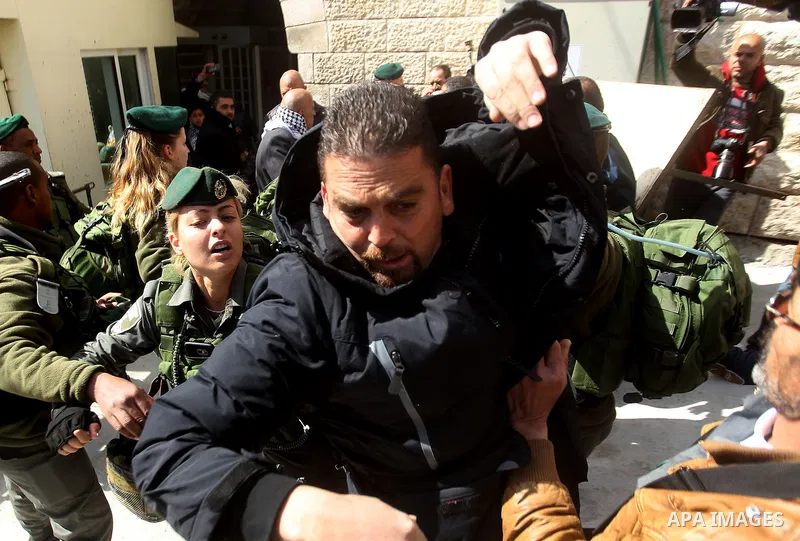 Israeli security forces scuffles with Palestinian protesters during a protest after Friday prayers outside the Ibrahimi mosque calling for the removal of settlers and reopening of a closed street in the West Bank town of...