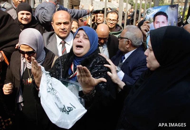 Egyptian family members of victims of the Port Said massacre react outside the Court of Cassation following the court's ruling in the case, in Cairo, on February 20, 2017. An Egyptian court upheld death sentences against...