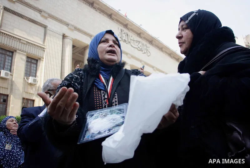 Egyptian family members of victims of the Port Said massacre react outside the Court of Cassation following the court's ruling in the case, in Cairo, on February 20, 2017. An Egyptian court upheld death sentences against...