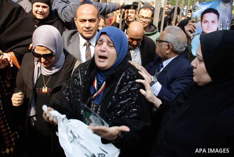 Egyptian family members of victims of the Port Said massacre react outside the Court of Cassation following the court's ruling in the case, in Cairo, on February 20, 2017. An Egyptian court upheld death sentences against...