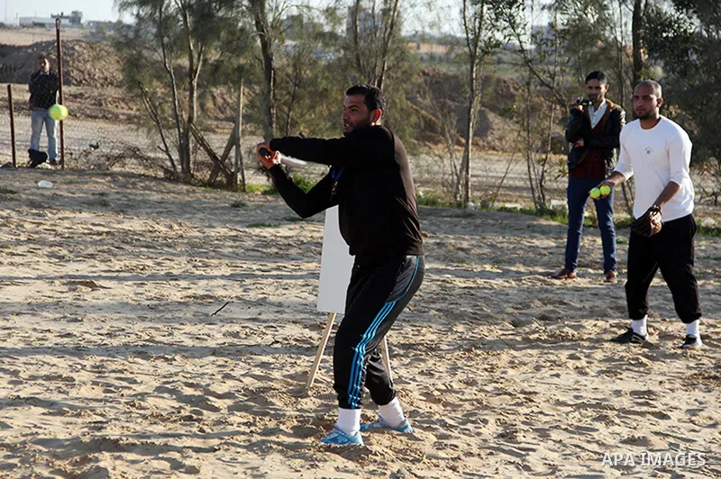 Palestinian youths take part in Baseball training, in southern Gaza strip, on February 20, 2017. Baseball is a bat-and-ball game played between two teams of nine players each, who take turns batting and fielding. Basebal...
