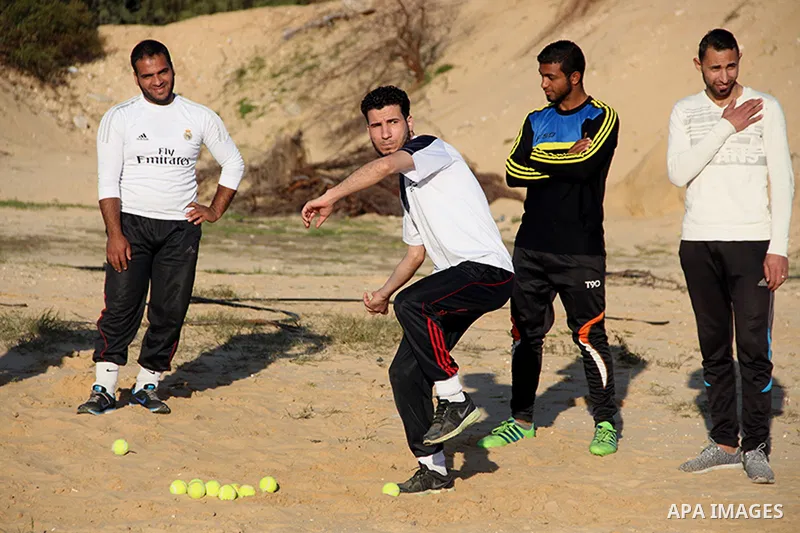 Palestinian youths take part in Baseball training, in southern Gaza strip, on February 20, 2017. Baseball is a bat-and-ball game played between two teams of nine players each, who take turns batting and fielding. Basebal...