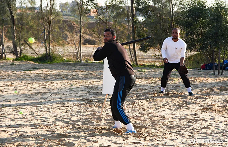 Palestinian youths take part in Baseball training, in southern Gaza strip, on February 20, 2017. Baseball is a bat-and-ball game played between two teams of nine players each, who take turns batting and fielding. Basebal...
