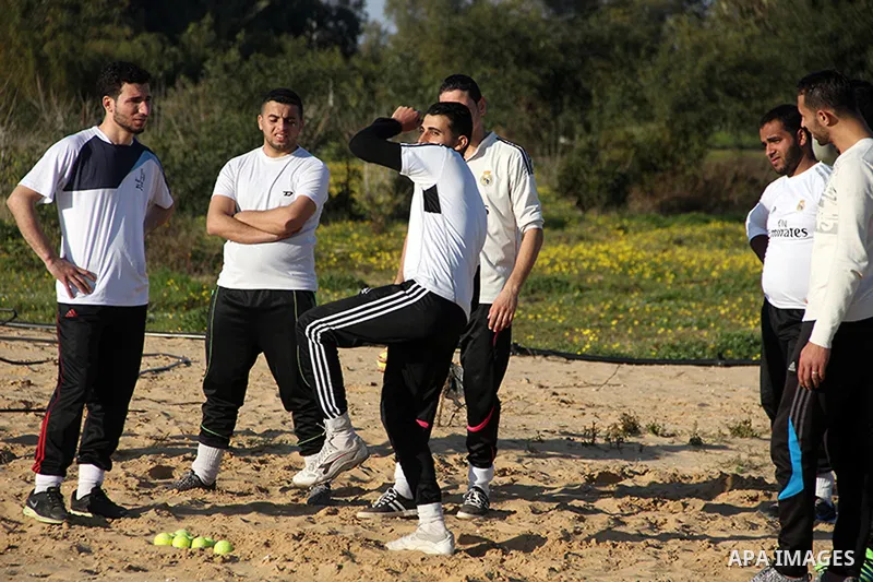 Palestinian youths take part in Baseball training, in southern Gaza strip, on February 20, 2017. Baseball is a bat-and-ball game played between two teams of nine players each, who take turns batting and fielding. Basebal...