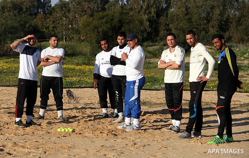 Palestinian youths take part in Baseball training, in southern Gaza strip, on February 20, 2017. Baseball is a bat-and-ball game played between two teams of nine players each, who take turns batting and fielding. Basebal...