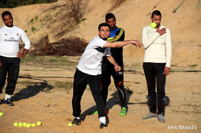 Palestinian youths take part in Baseball training, in southern Gaza strip, on February 20, 2017. Baseball is a bat-and-ball game played between two teams of nine players each, who take turns batting and fielding. Basebal...