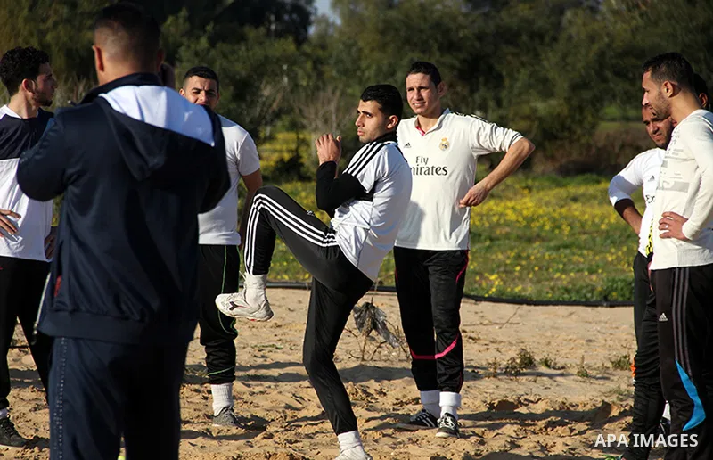 Palestinian youths take part in Baseball training, in southern Gaza strip, on February 20, 2017. Baseball is a bat-and-ball game played between two teams of nine players each, who take turns batting and fielding. Basebal...