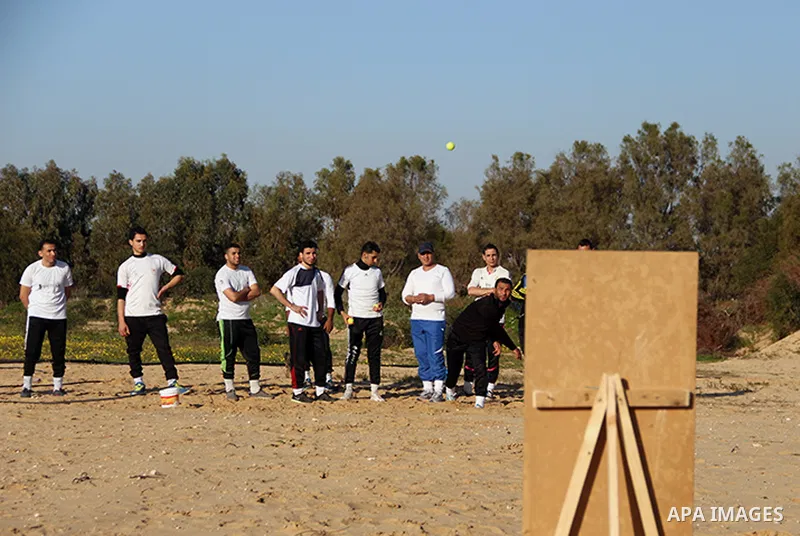 Palestinian youths take part in Baseball training, in southern Gaza strip, on February 20, 2017. Baseball is a bat-and-ball game played between two teams of nine players each, who take turns batting and fielding. Basebal...