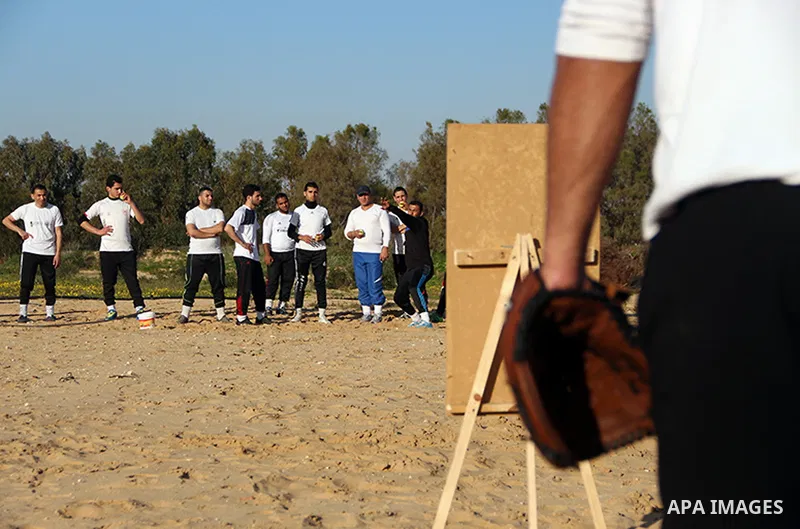 Palestinian youths take part in Baseball training, in southern Gaza strip, on February 20, 2017. Baseball is a bat-and-ball game played between two teams of nine players each, who take turns batting and fielding. Basebal...