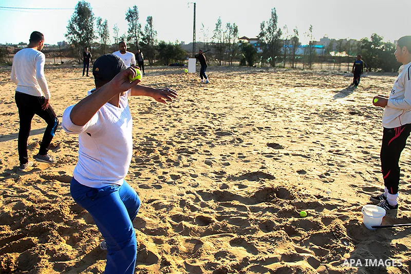 Palestinian youths take part in Baseball training, in southern Gaza strip, on February 20, 2017. Baseball is a bat-and-ball game played between two teams of nine players each, who take turns batting and fielding. Basebal...