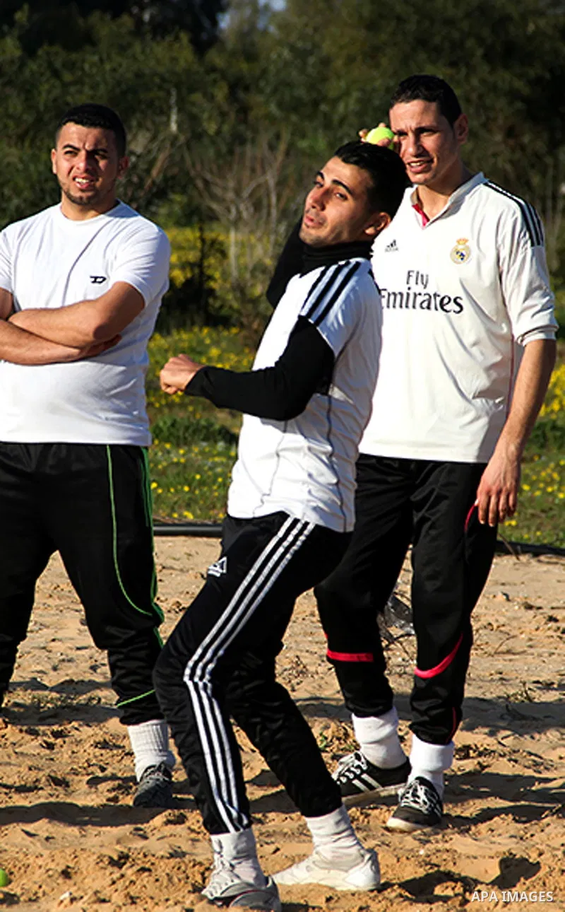 Palestinian youths take part in Baseball training, in southern Gaza strip, on February 20, 2017. Baseball is a bat-and-ball game played between two teams of nine players each, who take turns batting and fielding. Basebal...