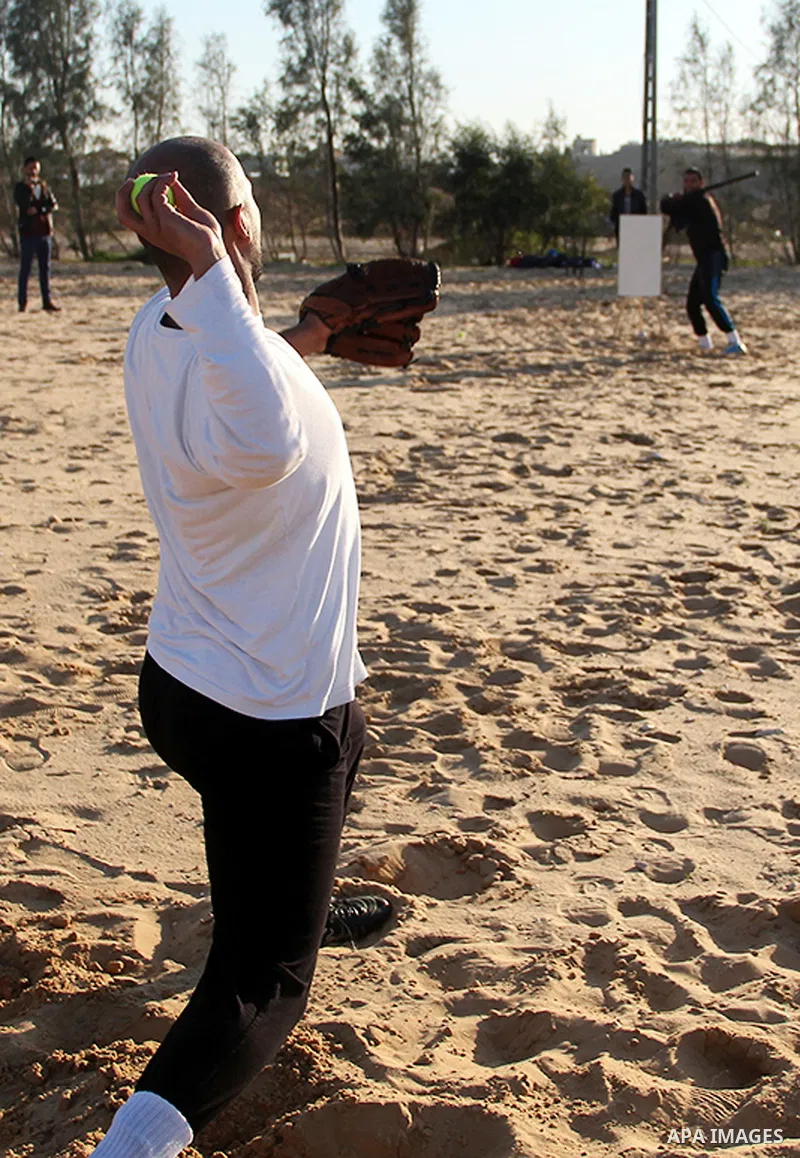 Palestinian youths take part in Baseball training, in southern Gaza strip, on February 20, 2017. Baseball is a bat-and-ball game played between two teams of nine players each, who take turns batting and fielding. Basebal...