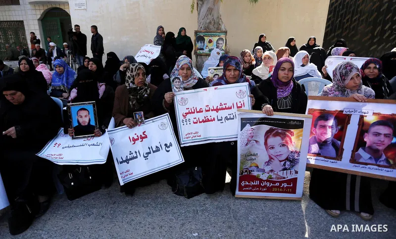 Palestinian families of martyrs take part a protest to demand their rights and salaries, in Gaza city, on February 21, 2017. Photo by Ashraf Amra