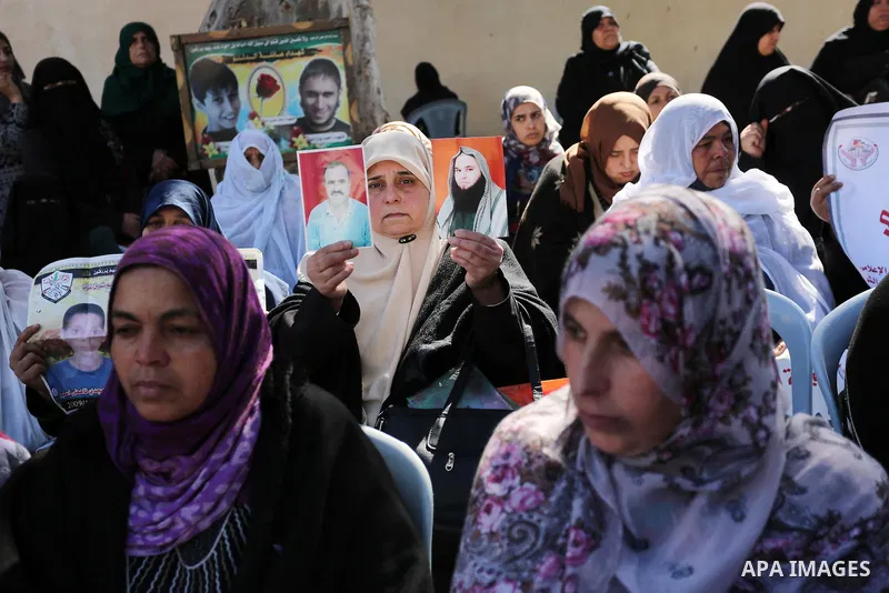 Palestinian families of martyrs take part a protest to demand their rights and salaries, in Gaza city, on February 21, 2017. Photo by Ashraf Amra